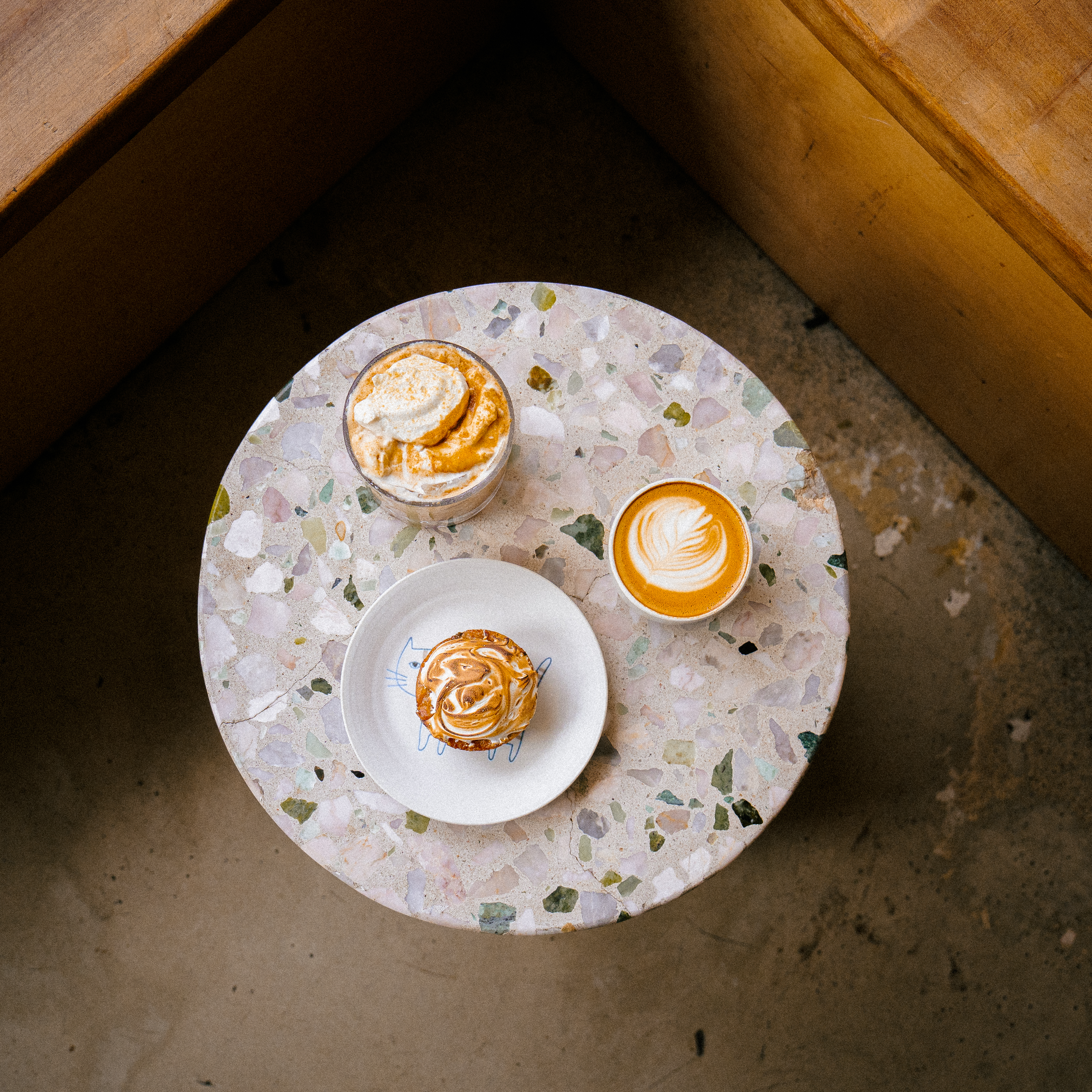 Butter mochi and specialty coffee on the counter at Pixlcat Coffee — the first butter mochi café in San Francisco and Boston