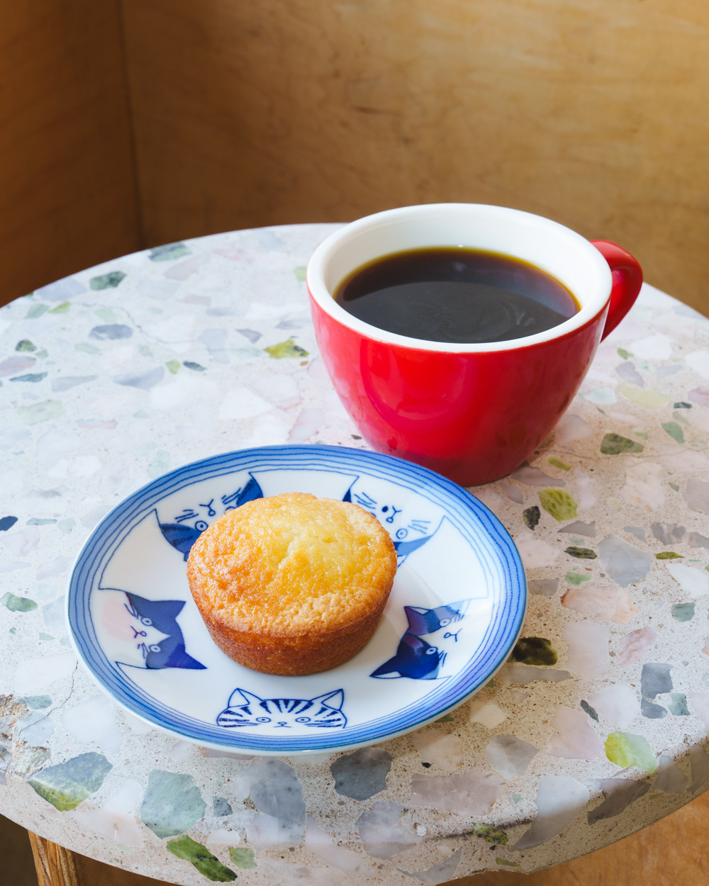 Butter mochi paired with black coffee at Pixlcat Coffee — the first butter mochi café in San Francisco and Boston